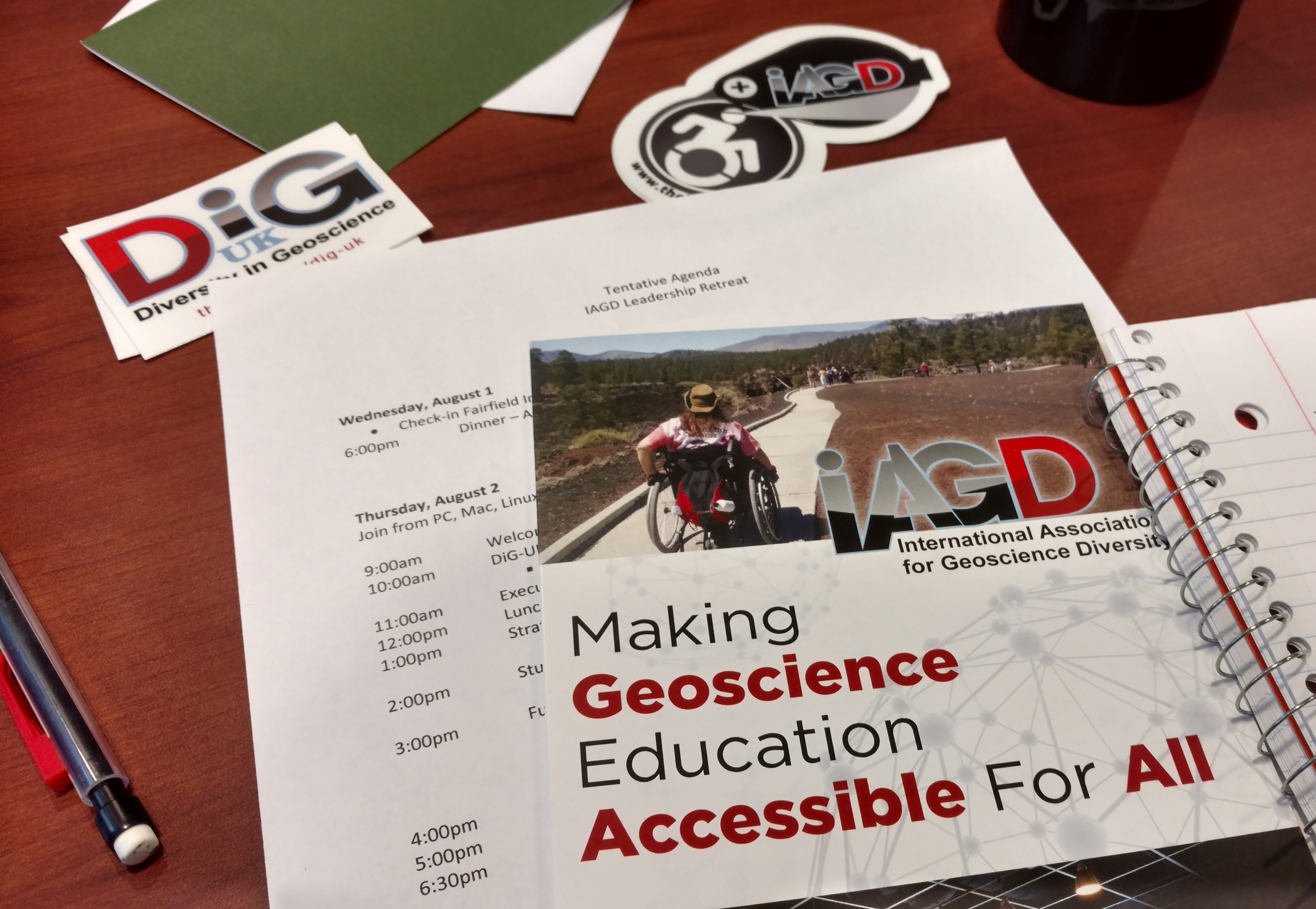 IAGD brochures, stickers, and an agenda from a 2019 leadership retreat.