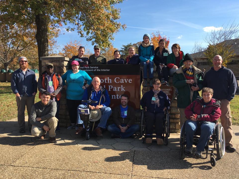 The field trip group poses with the sign in front of the vistior's center at Mammoth Cave National Park.